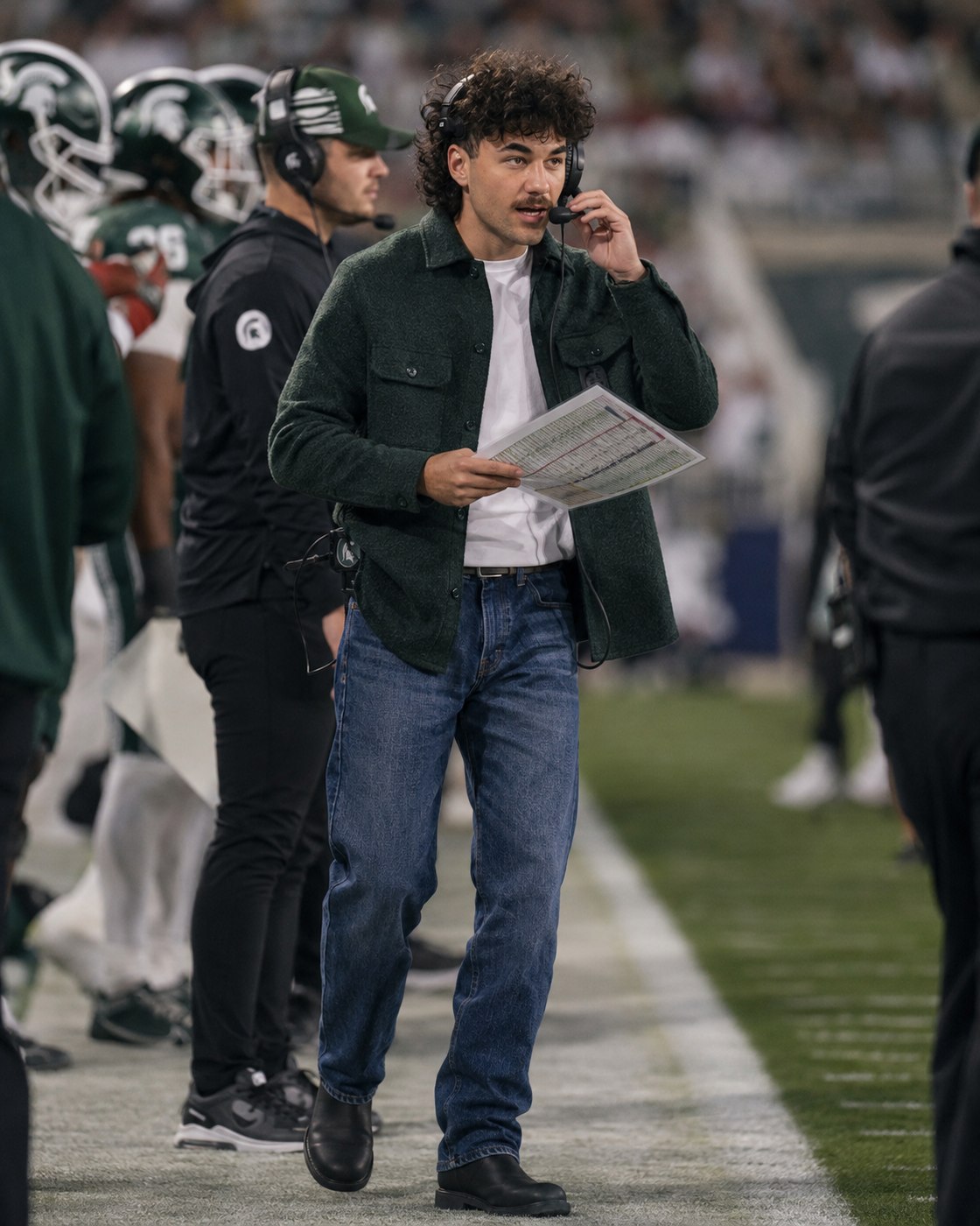 Nick Mansour with his call sheet on the Michigan State sideline