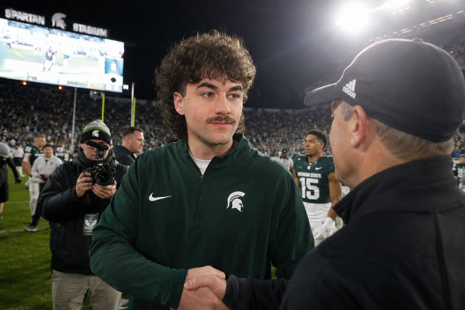 Nick Mansour shaking hands after a Michigan State game.