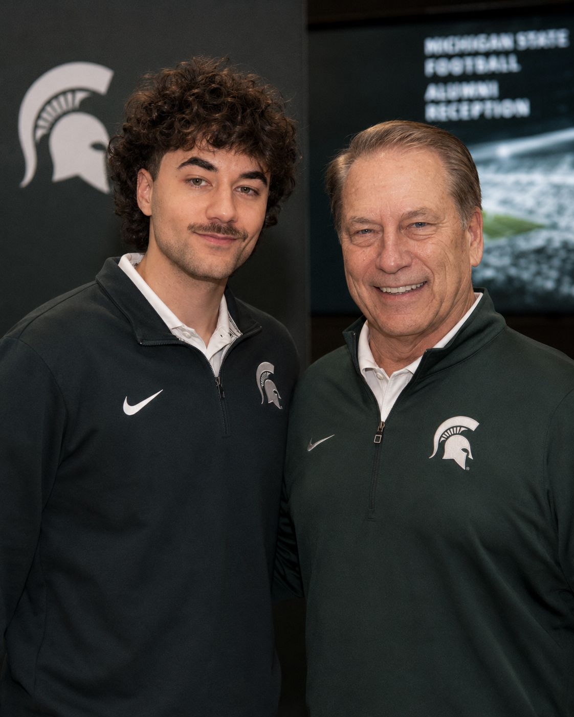 Nick Mansour standing with Tom Izzo at an alumni reception