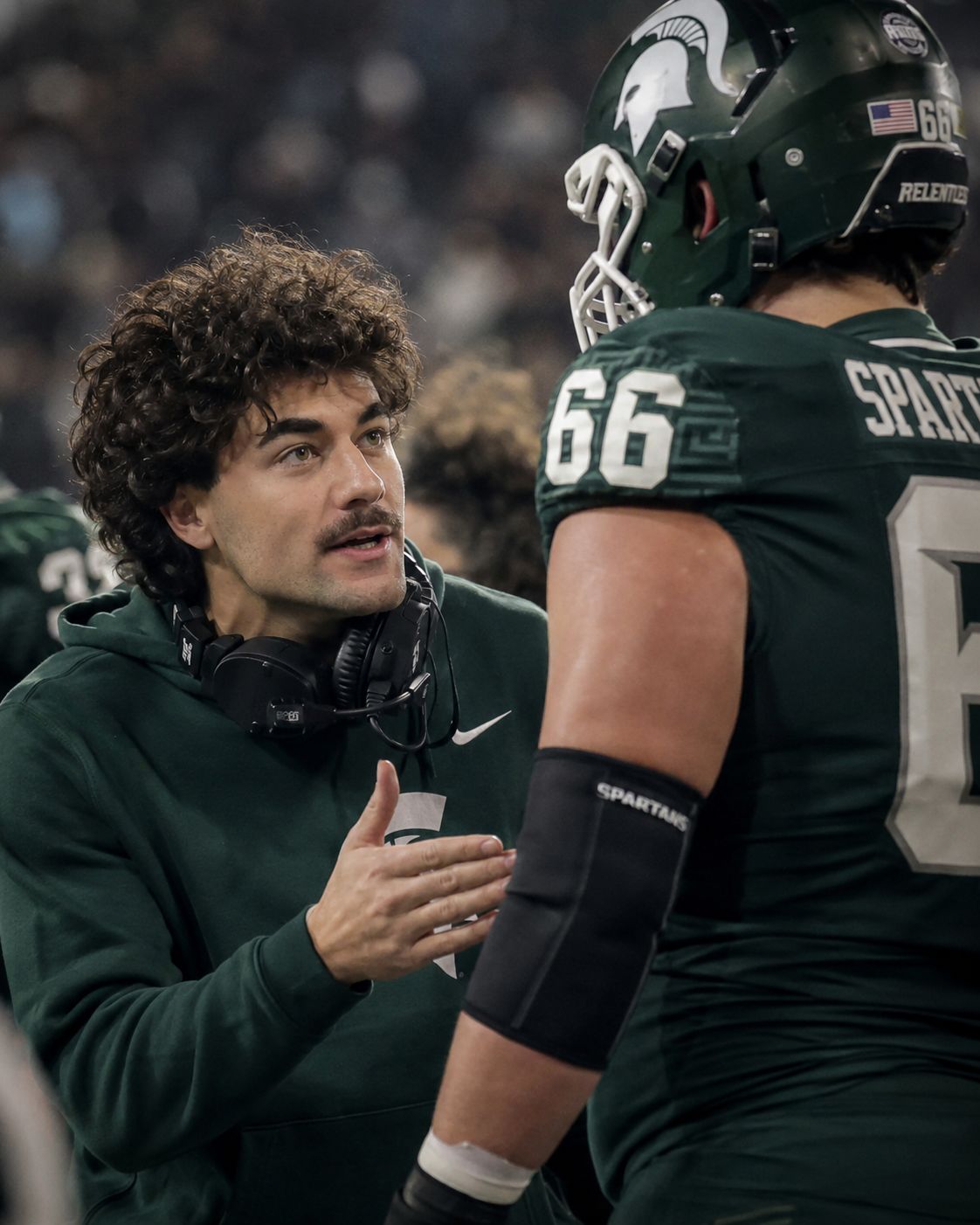 Nick Mansour with the offensive line during a game-week practice period